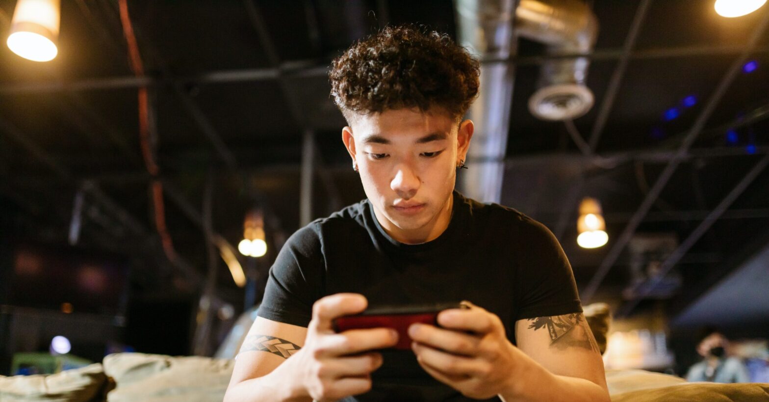 Man playing new game on smartphone