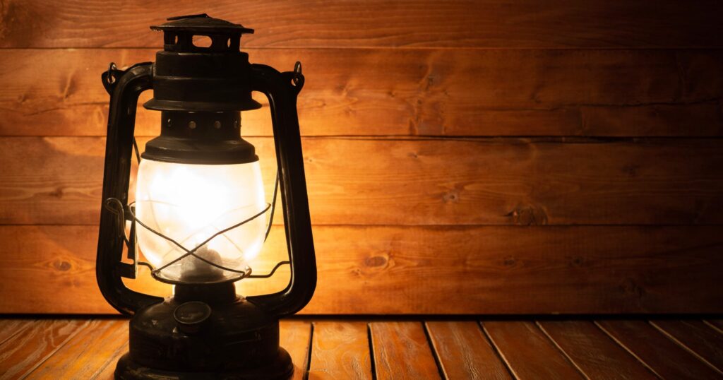 Lantern in front of a wooden wall